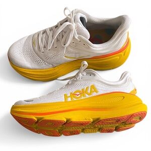 Hoka Women's White and Yellow Bondi 9 Running Shoes with Orange Accents